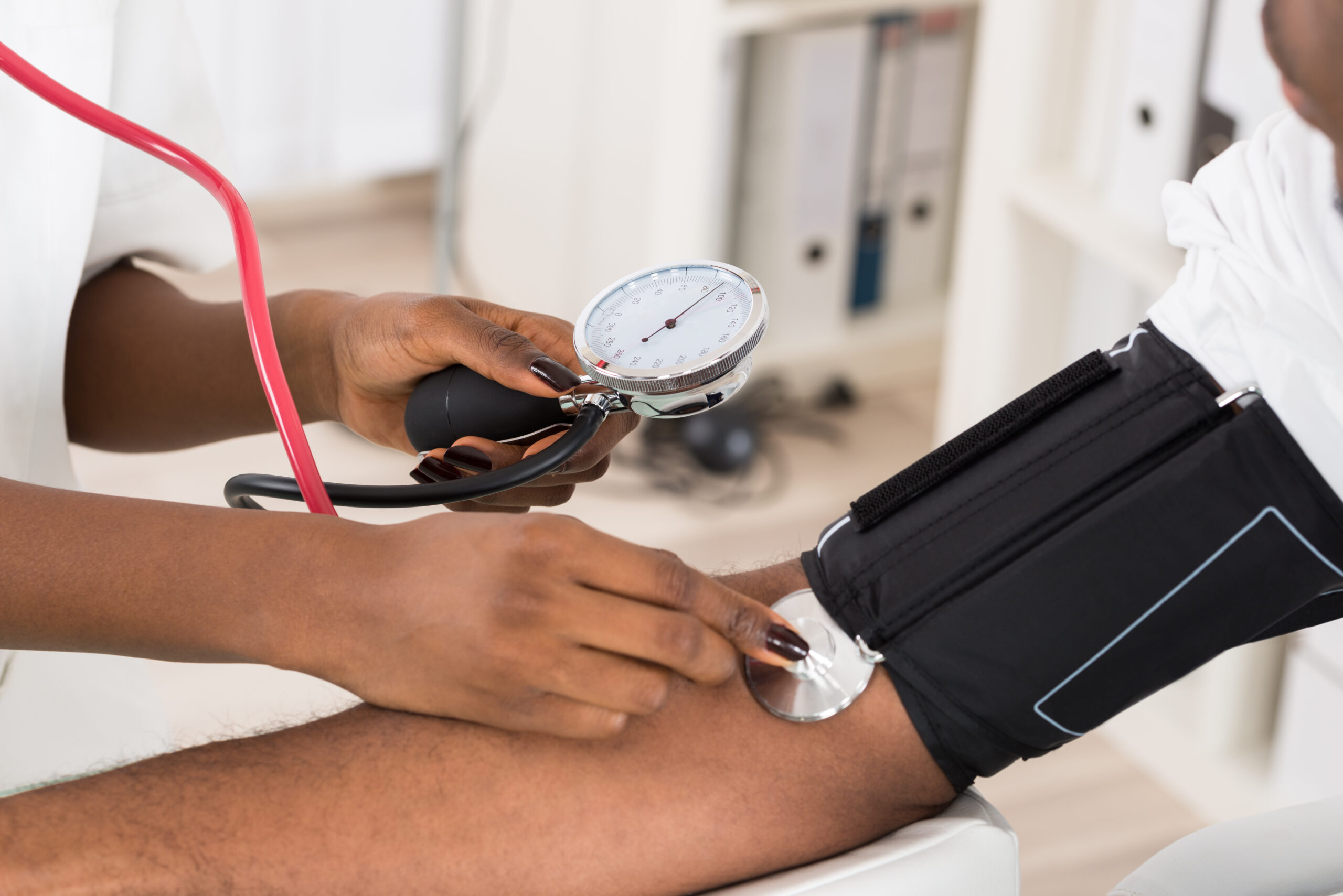 Doctor Measuring Patients Blood Pressure