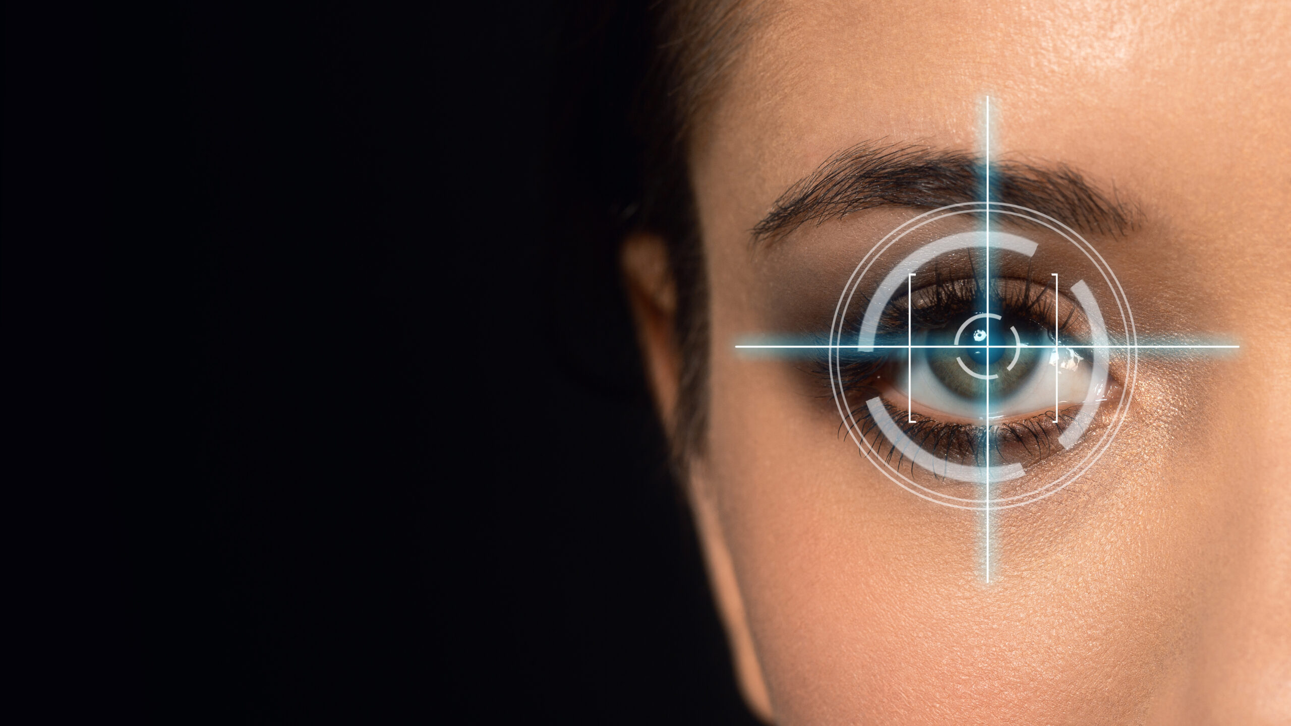 Laser scanning of female eye on black background, identity authentication, close up.