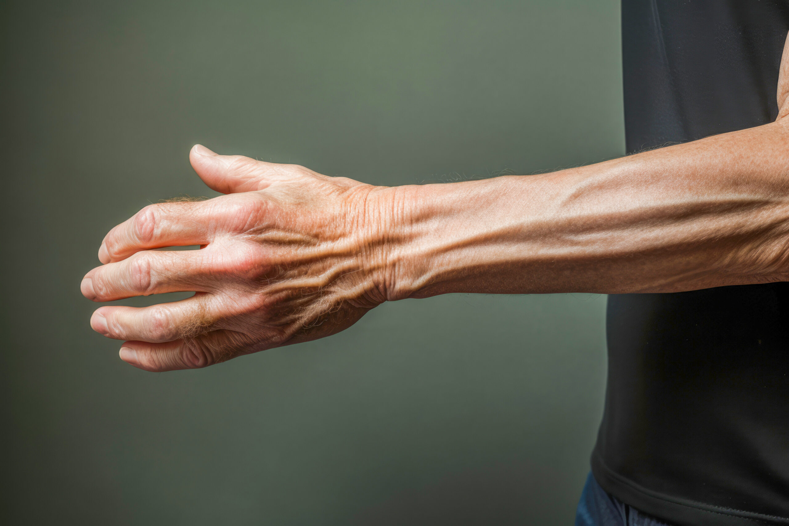 Managing Rheumatism: Inflamed joints and wrinkled hands in seniors require specialized care. Fingers tell a story of resilience and the importance of proper care.